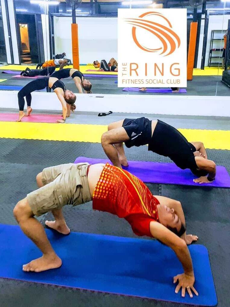 Fitness class practicing exercises on mats at The Ring Kun Khmer & Fitness in Phnom Penh