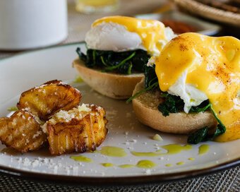 Eggs Benedict with spinach and potatoes for breakfast at Island Center Point hotel, Koh Rong Sanloem.
