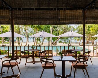 Open-air dining area facing the pool and beach at Island Center Point, Koh Rong Sanloem.
