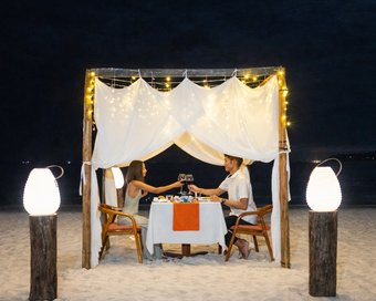 Beachside romantic dinner set up with canopy at Island Center Point hotel, Koh Rong Sanloem.