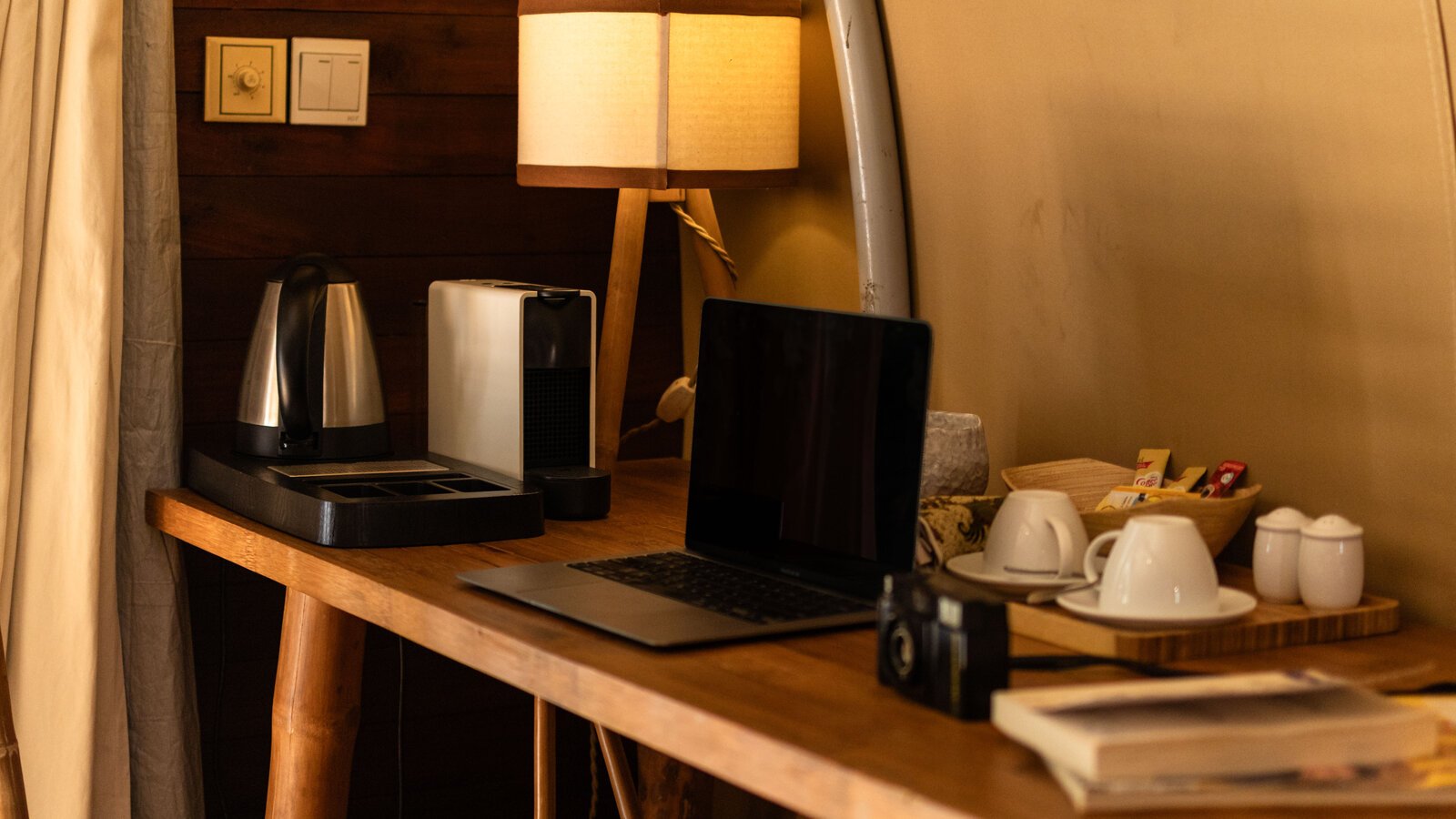 Wooden work desk inside the tented cabin room (Junglo)