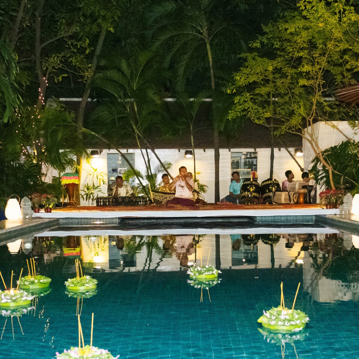 Traditional Khmer musician performance by the pool night.