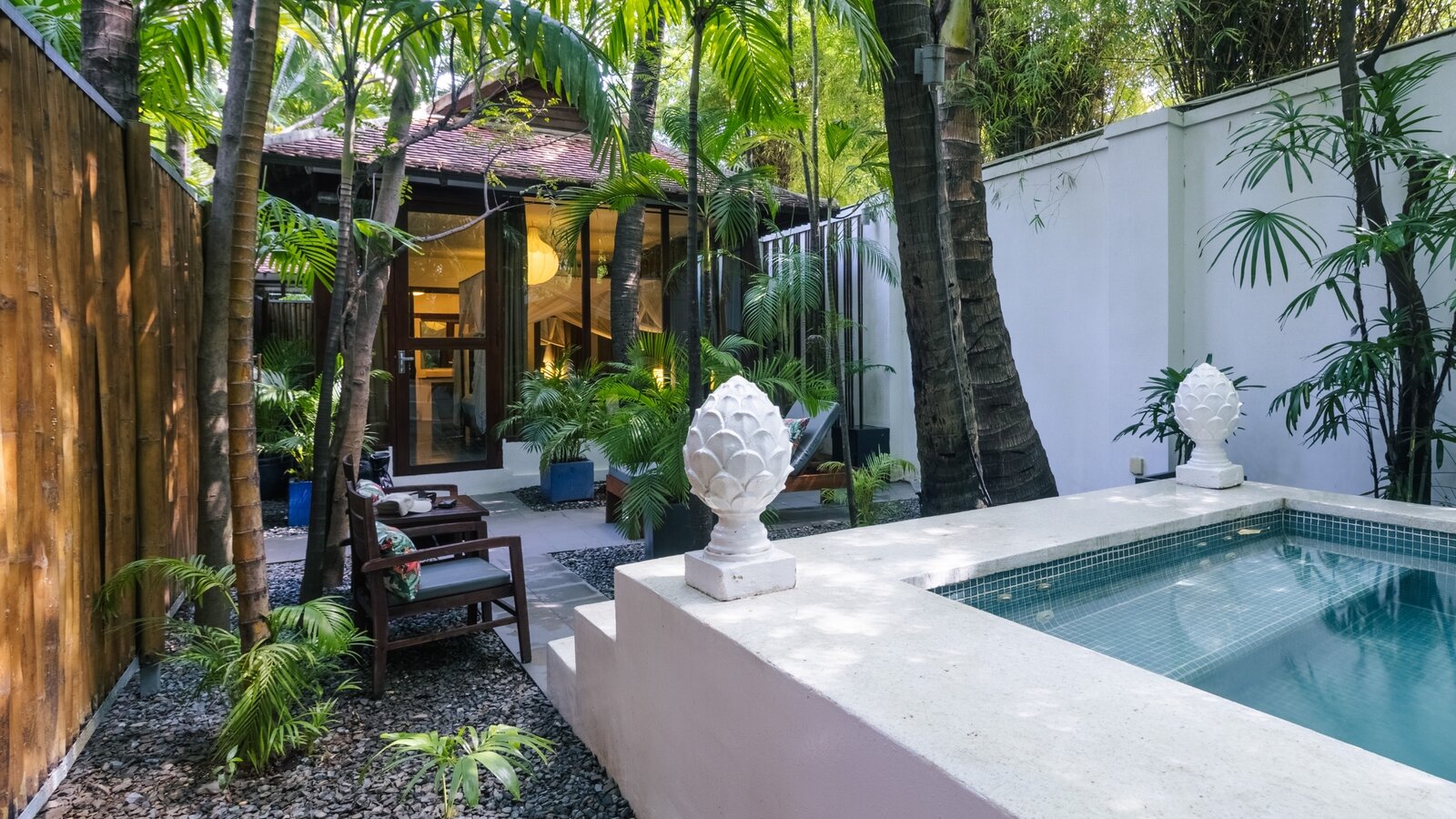Wooden and glass private jacuzzi suite exterior at Pavilion Phnom Penh.