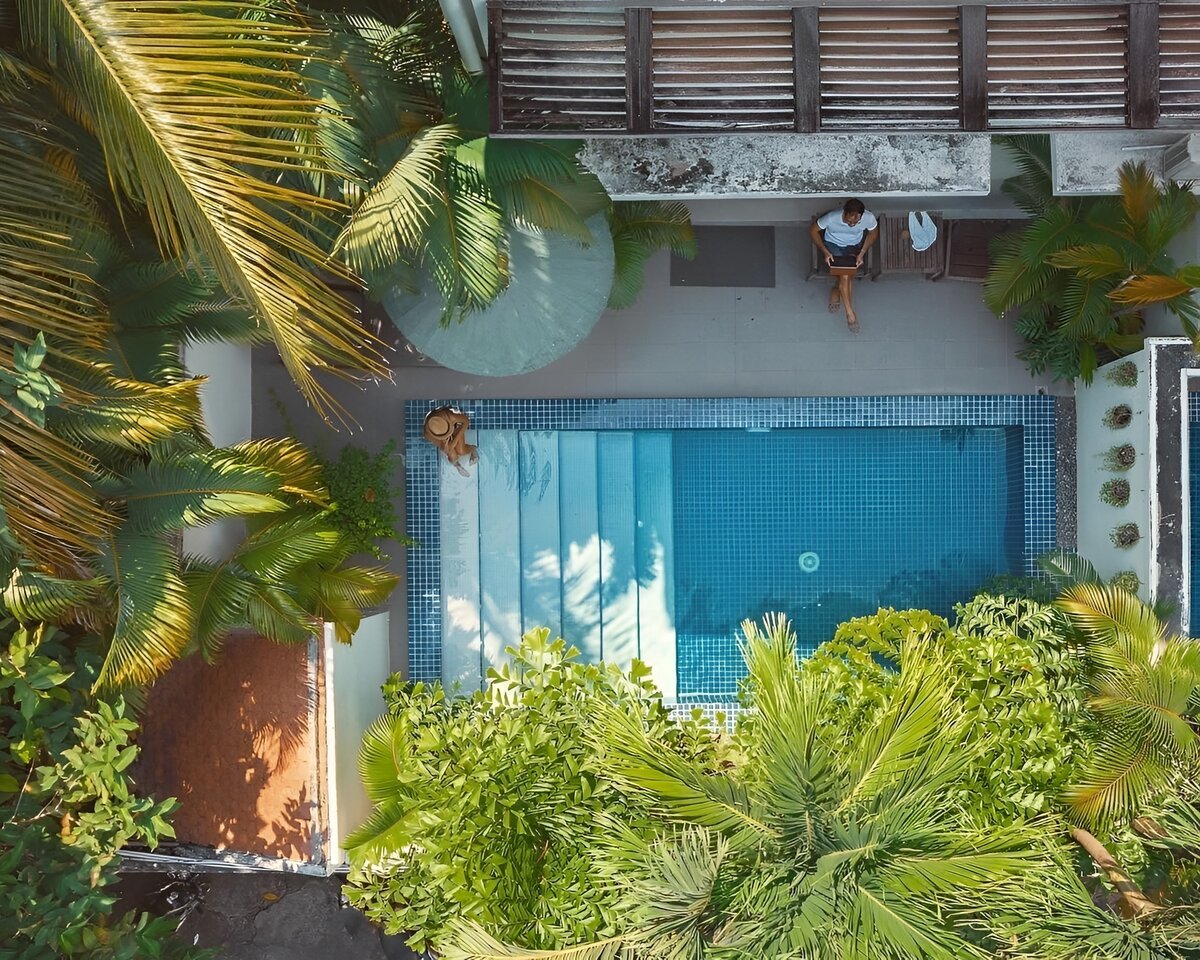 Aerial view of a Private Pool Room with its pool and tropical garden at Pavilion in Phnom Penh.