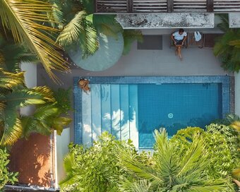 Aerial view of a Private Pool Room with its pool and tropical garden at Pavilion in Phnom Penh.