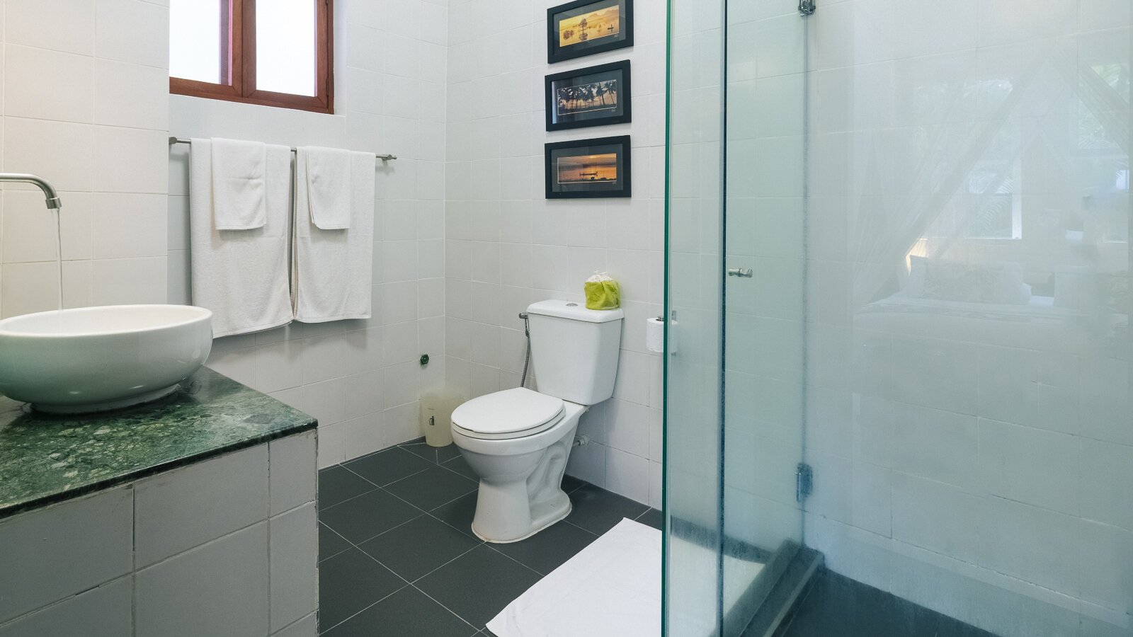 Bathroom with toilet and interior details in the Private Pool at Pavilion Phnom Penh.