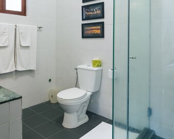 Bathroom with toilet and interior details in the Private Pool at Pavilion Phnom Penh.