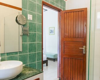 Bathroom vanity and sink area in the Private Pool room.