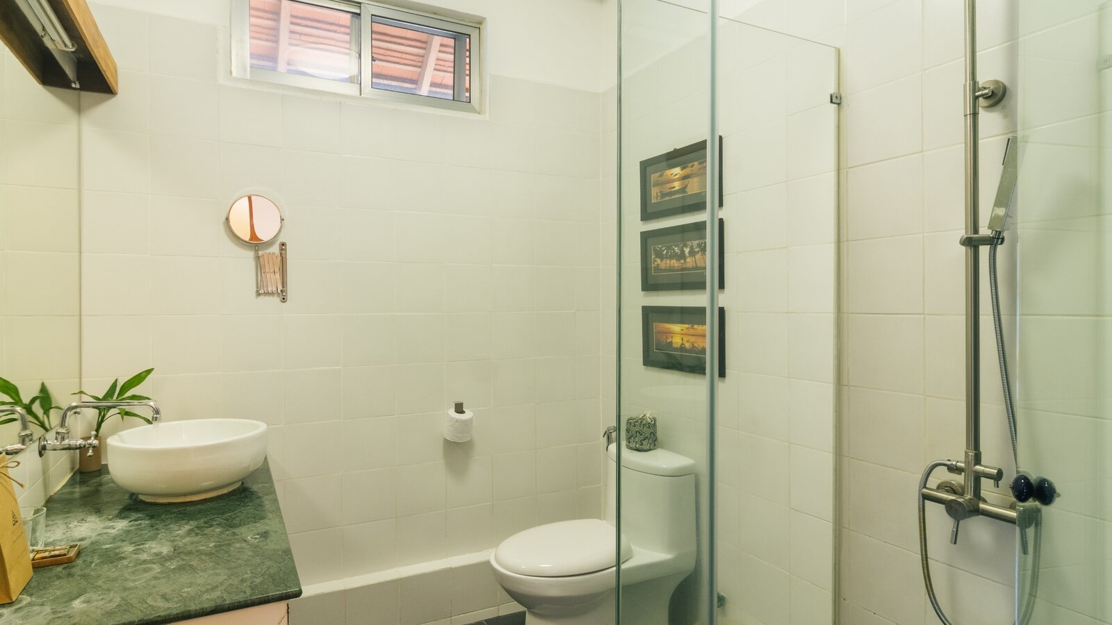 Twin room bathroom with walk-in shower, toilet and washbasin at Pavilion Phnom Penh