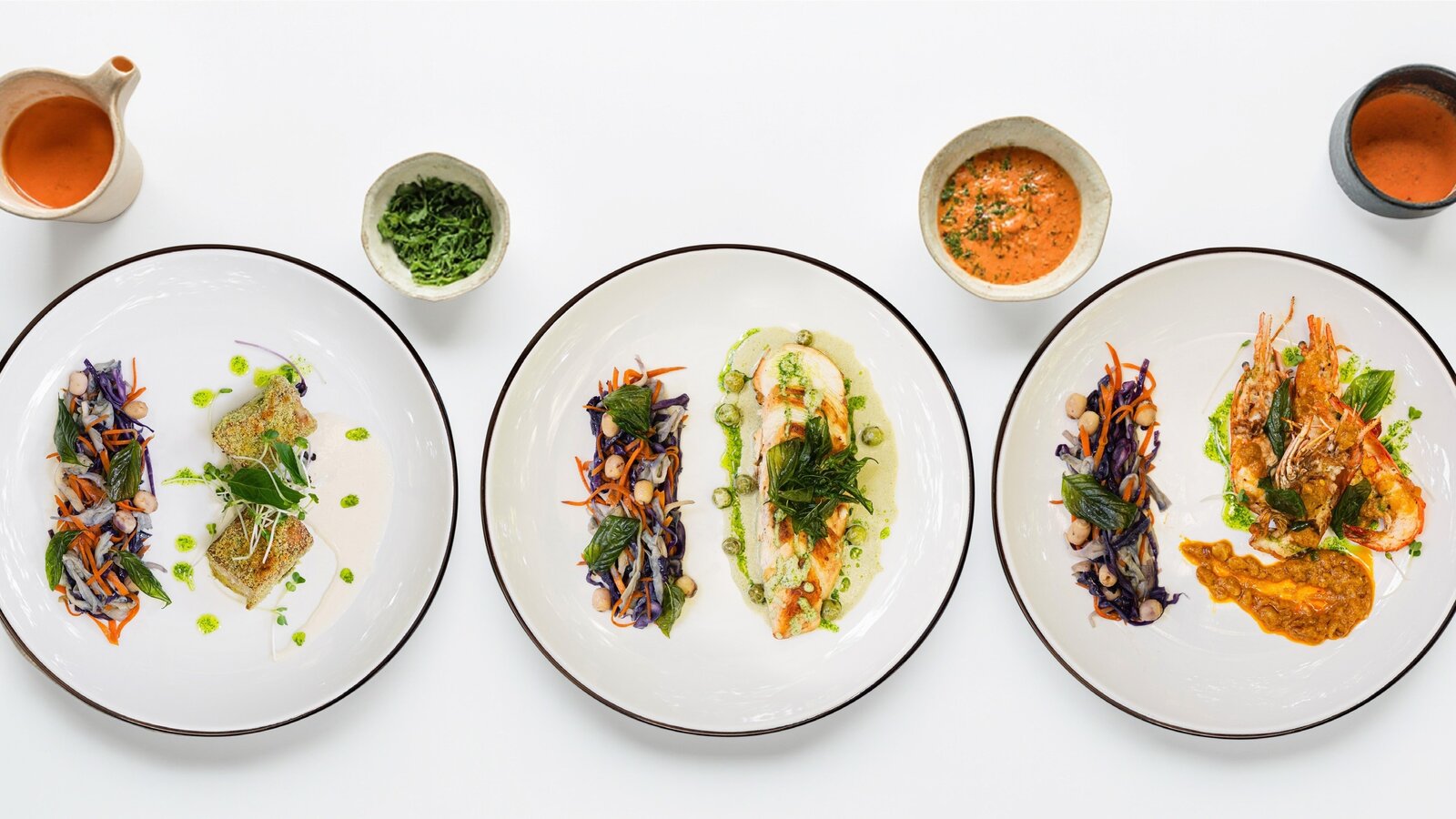 Three plated dishes presented as part of Pavilion's Culinary Art of Cambodia menu.