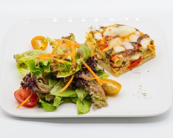 vegetarian quiche with mixed greens side.