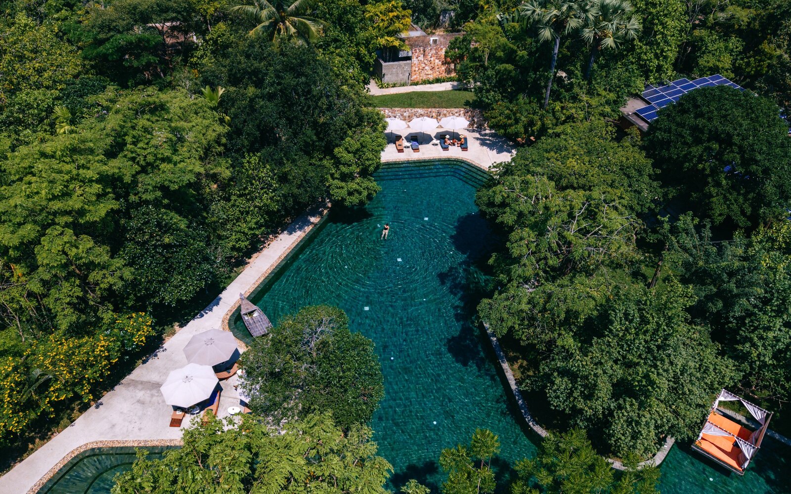 Main pool with boat and floating sala, Templation Angkor Resort, Siem Reap