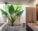 Open-to-the-sky bathroom with bathtub and shower, Templation Angkor Resort, Siem Reap